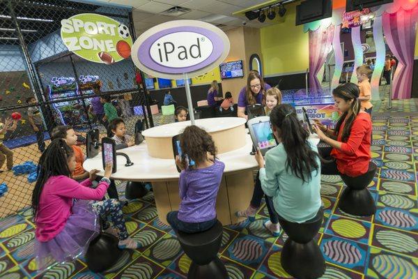 Kids Quest created a unique, multi-station iPad table to engage children of all ages in tablet play.