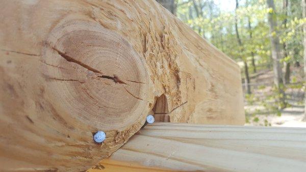 knotted up old lumber with nails sticking out