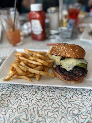 Cajun Blackened Chicken Sandwich topped with pepper Jack cheese and avocado served with Cajun fries. Prepared to perfection