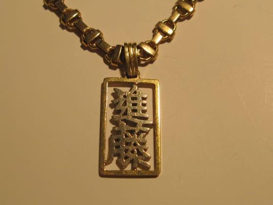 i had this made over 20 years ago at Mickey Seki. My Dad wrote it Mickey Seki turned it into a charm.