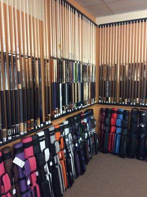 Approximately 200 cues and dozens of cases in stock.