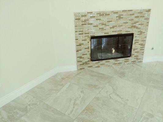 Tile floor & tile on the fire place installed by Orion flooring.