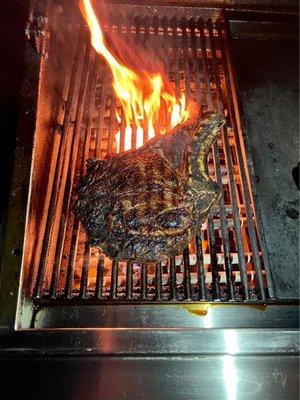 Ribeye steak on grill