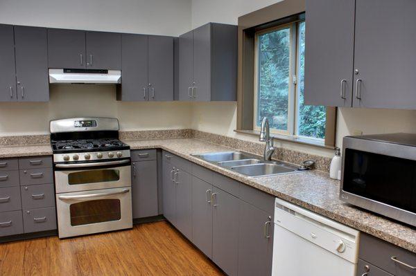 Kitchen with double oven and two refrigerators