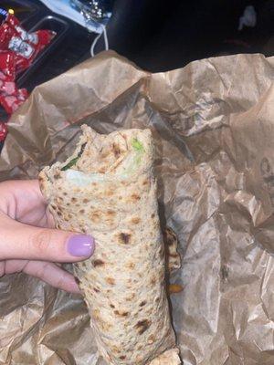 A chicken wrap with a hair