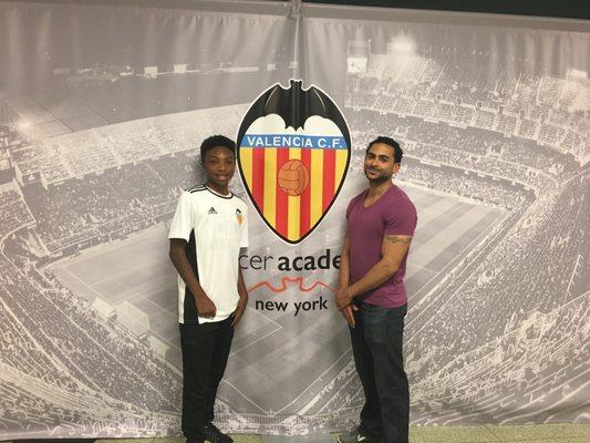 Our owner Antonio Lee posing with his father when he was signed to Valencia CF Academy.