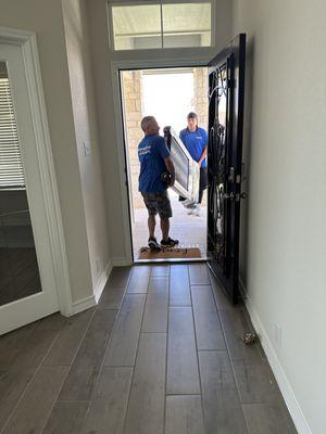 Bring in my treadmill. They wrapped it and took their time getting it up stairs.