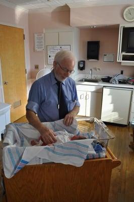 Our doctors round at the local hospitals. Dr T with one of our new babies :)