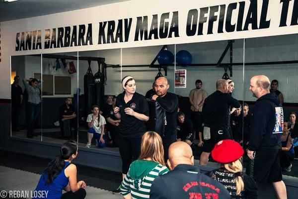 Instructor Elizabeth demonstrating an elbow strike at our Grand Opening