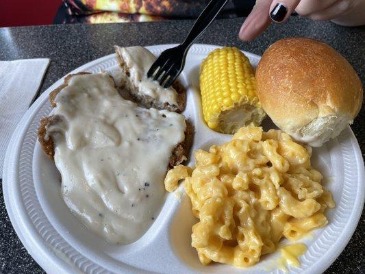 Chicken fried steak, Mac, corn on the cob with a roll.