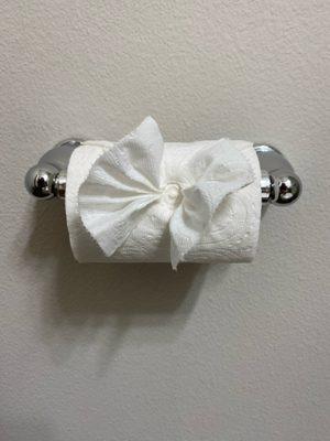 The toilet paper bow is such a sweet little detail. This is the first time we have had this design from cleaners. Next level. :)