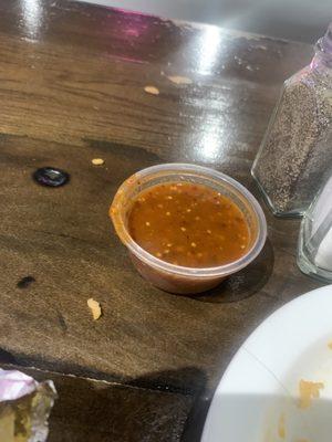 One dollar $1.50 for this small cup or salsa which should come with the meal