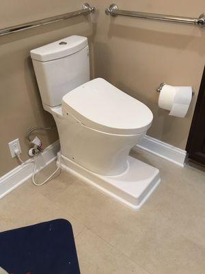 Toilet installation with riser