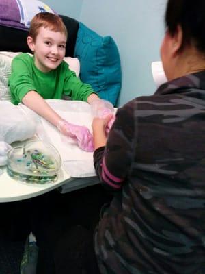 Nate, age 12, enjoying paraffin wax