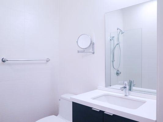 Full bathroom with European porcelain flooring & shower tiles + additional magnifying mirror