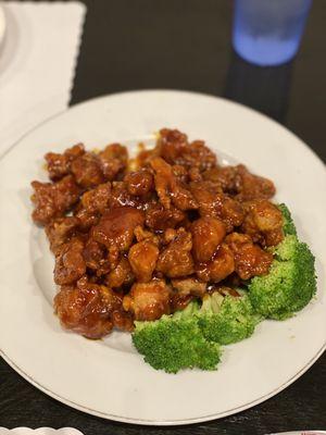 Orange chicken, seared alongside a big plate of white rice.