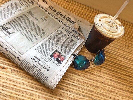 Daytime perfection: paper, shades, & a smooth nitro cold brew.