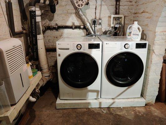 Installed a new outlet and a platform to fit washer and dryer.