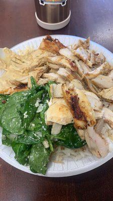 Chicken shawarma plate with rice hummus and spinach salad