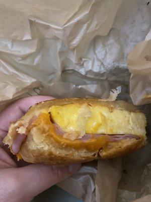 Ham egg and cheese breakfast sandwich on croissant