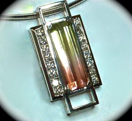 14 karat white gold Bi-Color tourmaline and diamond pendant.  Cutting edge designs custom made for you.