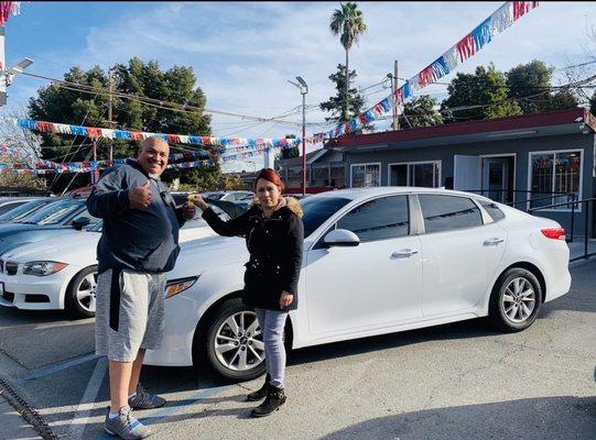 Me and Fabiola getting my new car..