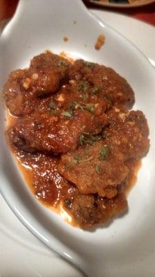 Delicious breaded an fried oysters with marinara sauce