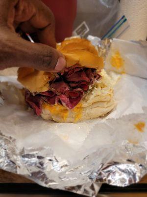 The Grandslam Pastrami, corn beef, melted Swiss, coleslaw, and Thousand Island dressing.