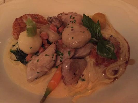 Wild partridge and root vegies over pasta in a champagne cream sauce.