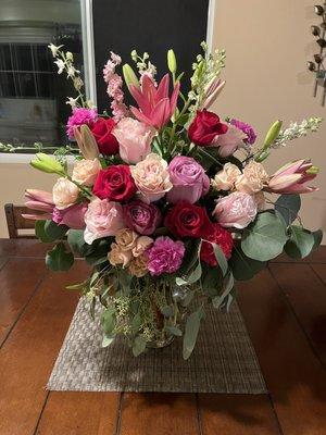 Roses, Garden Roses, Garden Spray Roses, Carnations, Lilies, Dollar Eucalyptus, and Seeded Eucalyptus