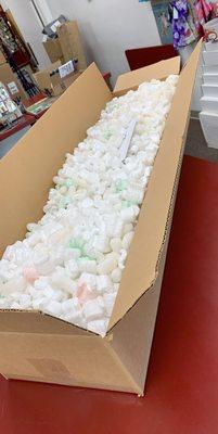 Huge, odd-sized box -- filled with a delightful amount of packing-peanuts; a secret-menu item, courtesy of the store's clerk, Richard.