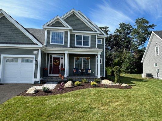 Design, planting of trees & shrubs, insertion of boulders & rocks and mulch. Lawn already existed.