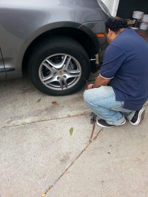 The other guy plugging the tire.