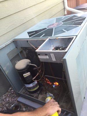 John burned off the debris from the AC unit allowing the unit the breath easier.