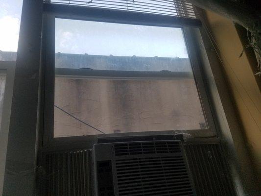 1 of the 2 windows that fell on top of me while I was sleeping. Won't lock. Barely holds AC unit.