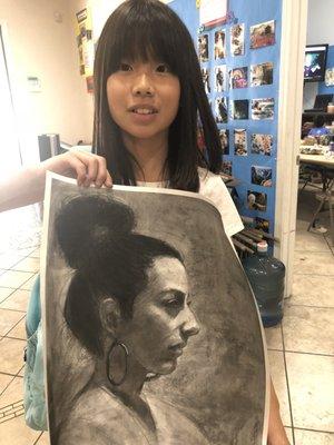 10-year old Luming with her first charcoal portrait