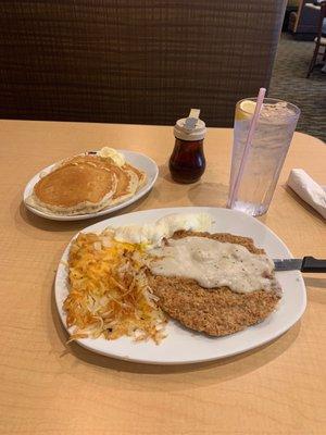 Country fried steak with eggs