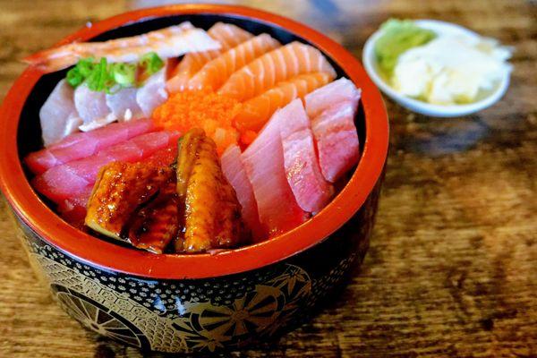 Chirashi Bowl: assorted sashimi over rice (salmon, tuna, yellow tail, albacore, broiled eel, scallop, shrimp, flying fish roe) ($18.75).