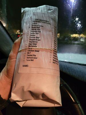 My sandwich,  with napkins, and ordering tag for next time