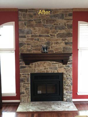 After- We insulated the chase, installed a high efficiency wood burning fireplace and refaced the facade with a stone veneer