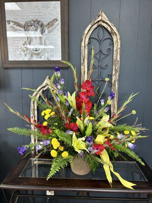 Sympathy arrangement with a mixed array of bright summer colors