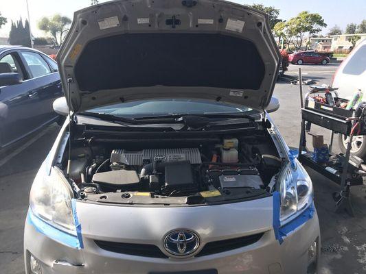 Head light restoration service on a Toyota Prius.