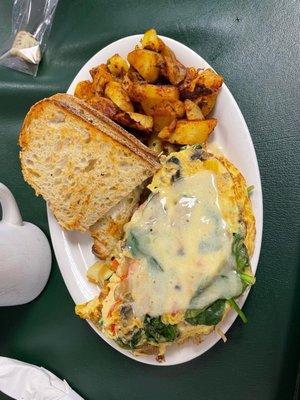 Veggie omelette with cheddar cheese and homemade hashbrowns