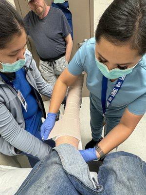 Professional nurses fixing a broken ankle.