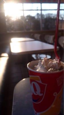 Sitting in the dining room of Dq with a PB cup blizzard