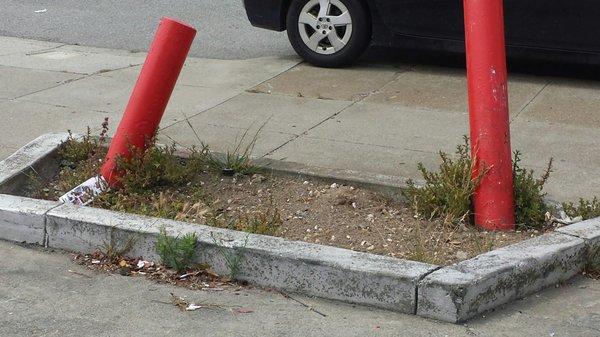 Run down station.  Embarrassment to our neighborhood has planters filled with trash and weeds.