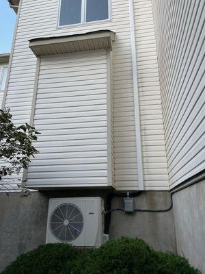 Mini split condenser paired with a ducted unit