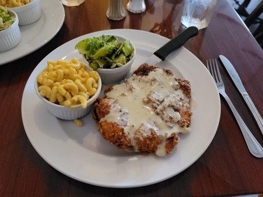 Fried chicken breast with gravy, Mac & cheese, and pistachio brussel sprouts