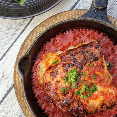 Eggplant Parmesan with San Marzano Tomatoes Sauce and Arugula with balsamic Vinaigrette