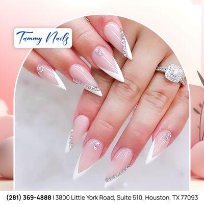 Sharp French nails with sparkling rhinestones, combining elegance and glamour